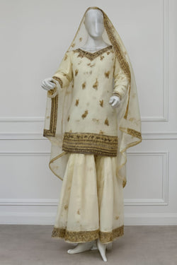 Cream and Gold Embroidered Sharara Suit with Floral Motifs and Sheer Dupatta
