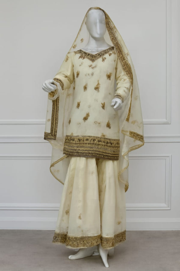 Cream and Gold Embroidered Sharara Suit with Floral Motifs and Sheer Dupatta
